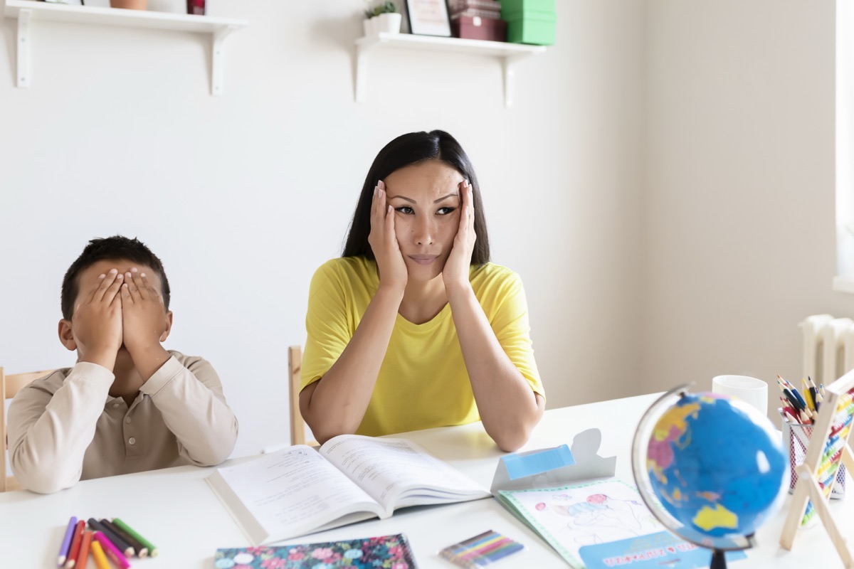 Stressed mother and son frustrated over homework